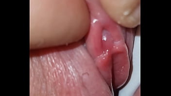 I discovered her petite clit while hiding behind her attractive cameltoe, causing her to reach orgasm