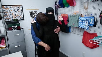 A teenage shoplifter wearing a hijab is confronted by an officer and given a lesson in punishment